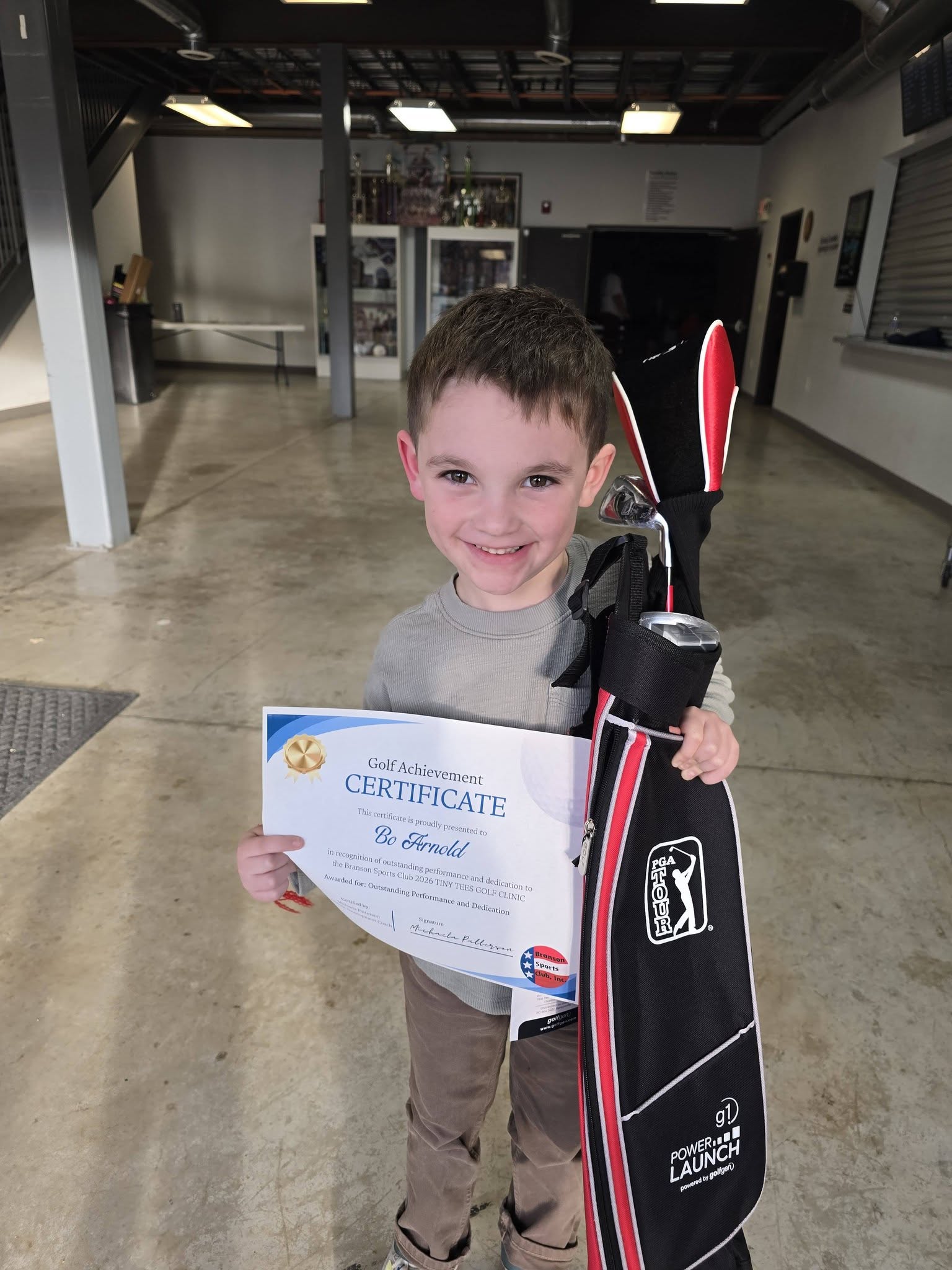 Young golfer practicing at Tiny Tees Golf Clinic