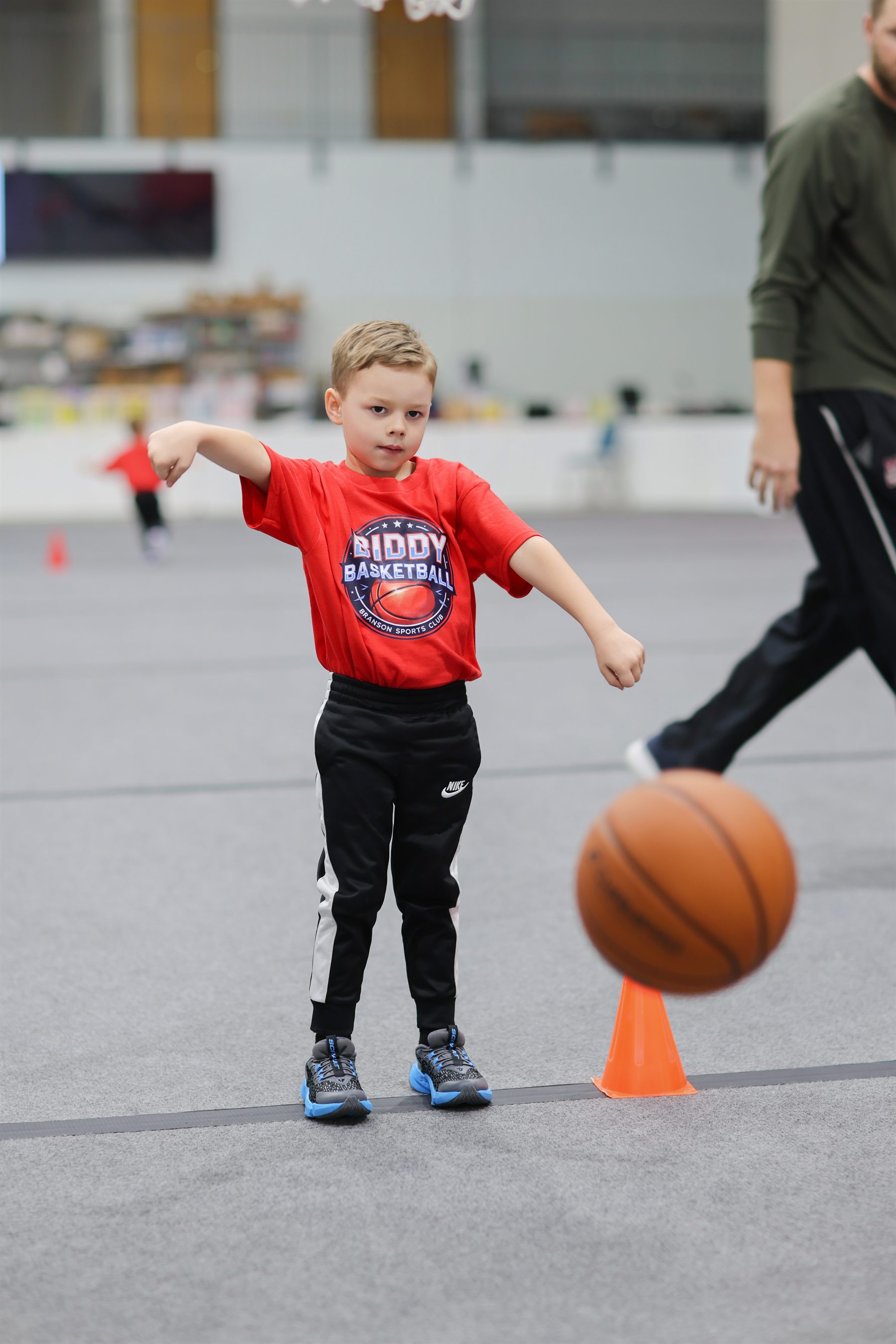 Young child practicing basketball dribbling