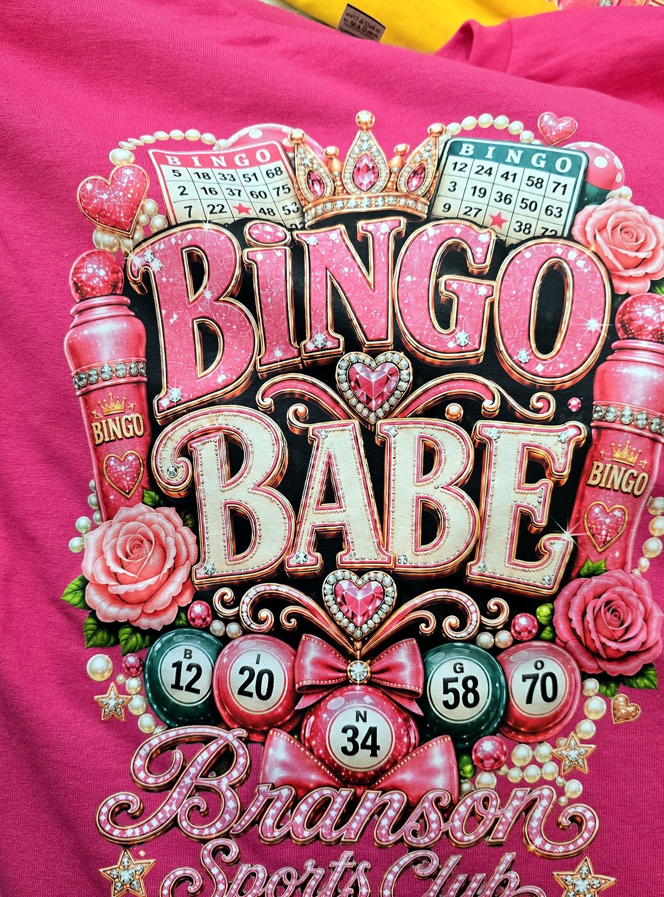 Bingo Babe photographed on hot pink shirt