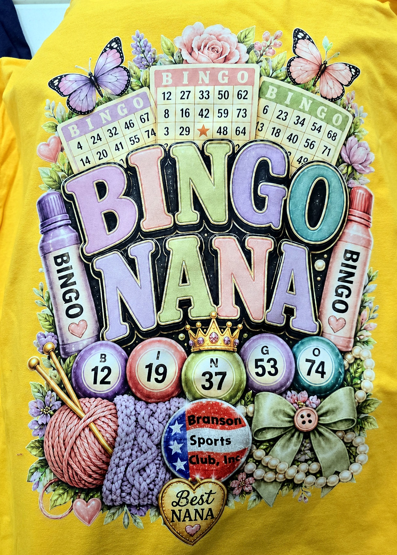Bingo Nana photographed on yellow shirt
